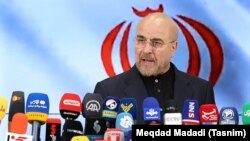 Mohammad Baqer Qalibaf addresses the media after registering to run in the presidential election in Tehran on June 4.