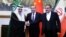 Chinese Foreign Minister Wang Yi (center) poses with Ali Shamkhani, secretary of Iran's Supreme National Security Council (right) and Saudi Arabia's national security adviser, Musaad bin Muhammad al-Aiban (left), in Beijing on March 10.