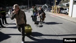 რუსეთიდან საქართველოში გადმოსული რუსეთის მოქალაქეები. ზემო ლარსის სასაზღვრო-გამშვები პუნქტი, 26 სექტემბერი, 2022 წ.