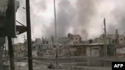 Гӯшае аз даргириҳо дар маҳаллаҳои атрофи шаҳри Ҳимс. 