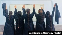 Female students remove their head scarves as a form of protest as thousands of Iranians have taken to the streets to demand more freedoms and women's rights. 