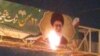 Videos posted on social media in recent days have shown protesters in several Iranian cities set fire to propaganda banners hung by the government to promote the revolution and anniversary celebrations around it.