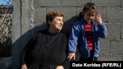 ნაზი ბეროშვილი შვილიშვილთან ერთად.