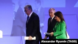 Президенты Казахстана и России Касым-Жомарт Токаев и Владимир Путин, а также главный редактор RT Маргарита Симоньян