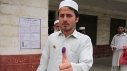 A voter shows his inked thumb in the Khyber tribal district after casting his ballot.