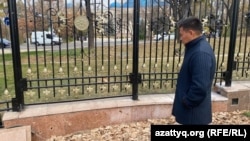 Kosai Makhanbaev looks at the holes in the slab left by the January 2022 shooting. October 29, 2025