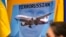 Изображение президента РФ Владимира Путина на плакате участников акции протеста в столице Австралии спустя два дня после сбитого 17 июля российскими гибридными силами. Сидней, 19 июля 2014 года 