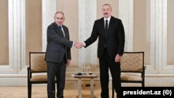 Никол Пашинян и Ильхам Алиев на встрече в Абу-Даби, 10 июля 2025 года