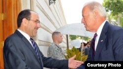 Iraqi Prime Minister Nuri al-Maliki (left) welcomes U.S. Vice President Joe Biden to Baghdad on August 31.