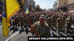 Під час Маршу ветеранів війни України з Росією у День Незалежності України, який був організований у відповідь на скасування президентом України Володимиром Зеленським військового параду. Київ, 24 серпня 2019 року