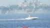 An Iranian military speedboat patrols near the USS Bataan in the Strait of Hormuz.(file photo)