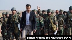 სირიის ლიდერი ბაშარ ალ-ასადი და სირიელი ჯარისკაცები. 2019 წელი.