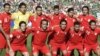 Rahman Rezaei (third right at back) poses with Iran's national soccer team in 2006.