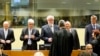 Jadranko Prlić, Bruno Stojić, Slobodan Praljak, Milivoj Petković, Valentin Ćorić i Berislav Pušić uoči presude pred Haškim sudom za ratne zločine u Jugoslaviji (ICTY), 29. maja 2013. Iako osuđenici u Hrvatskoj su odlikovani državnim odličjima.
