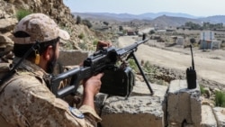 A Taliban soldier guards a road near the Ghulam Khan zero-point border crossing between Afghanistan and Pakistan in Gurbuz district in the southeast of Khost Province on October 20, 2025.