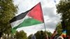 A protester waves a Palestinian flag during a march asking for the "recognition of the State of Palestine and the end of the genocide", in Paris on September 21, 2025.