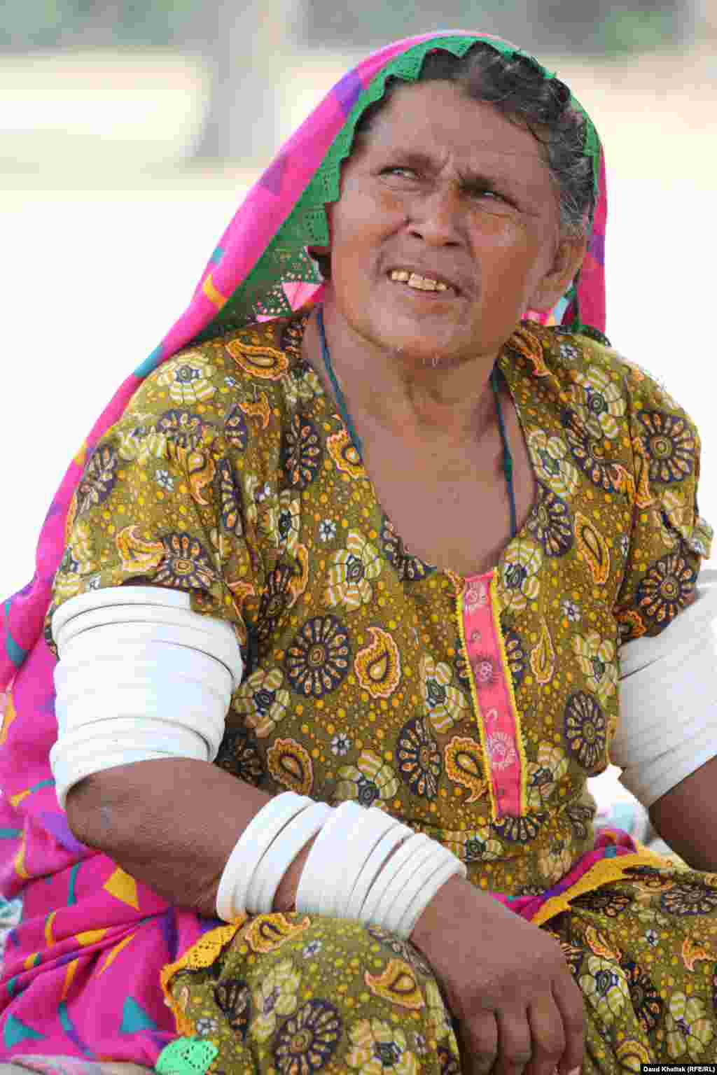 Kallan Bibi, 50, says she has never left the area and does not like to travel by car, bus, or truck. &ldquo;I am happy here, but the heat wave is very strong these days and I am also getting old,&rdquo; she says.