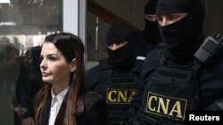 Evghenia Guțul a fost escortată de CNA la ședința de judecată de la sediul Ciocana al Judecătoriei Chișinău, 28 martie 2025.