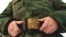 Russia -- A young man, just called-up to the military service, fastens the belt in the call-up center in the city of Kemerovo, 18Nov2007