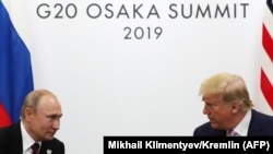 U.S. President Donald Trump (right) said he and his Russian counterpart Vladimir Putin (left) "talked a lot about arms control" at the G20 summit in Japan. 