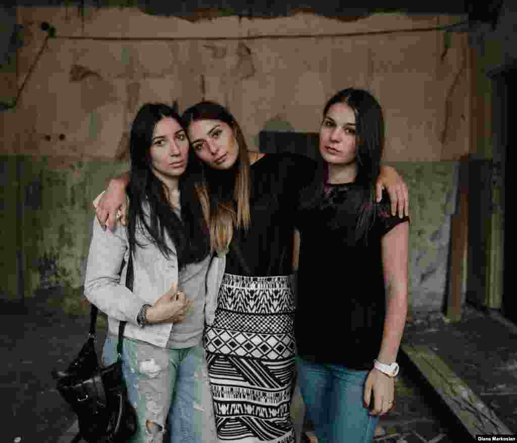 Lena Gaitova (left) and sisters  Zarina (center) and Rozita Tsirikhova were 12, 14, and 10... on September 1, 2004. The girls escaped at the end of the siege, but when Lena got home, she found her parents dressed in black and her 16-year-old brother, Alan, missing. First her parents said he was in the hospital. But soon they admitted he had died at the school. Today, the three girls remain best friends. All three study at the same institute in Moscow; Zarina has already graduated. They are pictured in the former library of School No. 1, where the militants stored their weapons. "It was easier before, when we were little and we didn't understand everything," says Lena. "We didn't understand what it meant when suddenly there were seven fewer of our friends in class. Now we're grown up. As time goes by, the pain doesn't go away. Quite the opposite, it gets harder. We are more aware." 