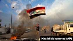 فعالان عرب نزدیک به هشام الهاشمی از او به عنوان فعال اصلاحطلب نام بردهاند که در اعتراضات اخیر مردم عراق همراه با آنان بود (عکس از آرشیو)