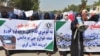 Afghan women march in Jalalabad in support of the peace talks between the Afghan government and the Taliban as they demanded a permanent cease-fire on September 16.