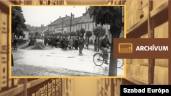 Zsidók gyalogmenete a kőszegi Schey Fülöp utcai gettóból a vasútállomásra 1944. június 18-án. A szombathelyi gettóba történő átszállításuk után, 1944. július 4-én, Auschwitzba deportálták a foglyokat. (Fortepan)
