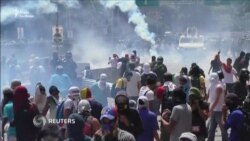 Масові заворушення у столиці Венесуели (відео) Масові заворушення у столиці Венесуели (відео)