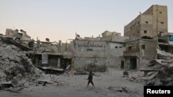 Разрушенные при авиаударах дома в Алеппо