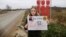 Ангелина Иванова с плакатом против полигона