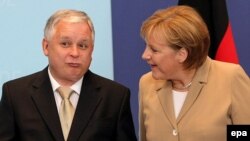 Ярослав Качинський і Ангела Меркель, Брюссель, фото 2007 року