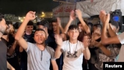 პალესტინელები ზეიმობენ ცეცხლის შეწყვეტის შეთანხმებას, ხან იუნისი, 2025 წლის 9 ოქტომბერი