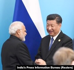 Нарендра Моди и Си Цзиньпин на одном из предыдущих саммитов ШОС в Циньдао (КНР) в 2018 году