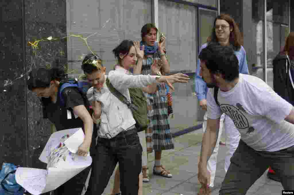 An egg splatters over young gay-rights activists after an attempted "kiss-in" in front of the Russian parliament in Moscow in 2013. Vladimir Putin himself has maintained a publicly benign attitude to Russia's LGBT community and has repeatedly claimed Russia does not discriminate against gays. 