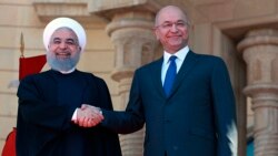 Predsednik Iraka Barham Salih i predsednik Irana Hasan Rohani, prilikom susreta u Bagdadu, 11. marta 2019.