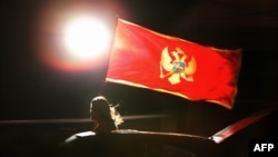 Montenegro – Referendum, a pro-independence supporter celebrates after Montenegrins narrowly voted for independence in a referendum, Podgorica, 21May2006