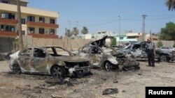 The site of a recent car bomb attack in Baghdad's Kadhimiya district