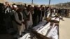 People attend the funeral of victims after a landmine targeted a minibus full of passengers in a Taliban-controlled area of Wardak Province, some 40 kilometers from Kabul, on October 20.