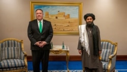 U.S. Secretary of State Mike Pompeo and Taliban Political Deputy Mullah Baradar in Doha on September 14.