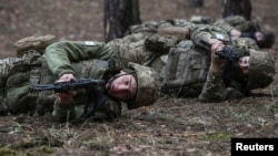 Young recruits of the Ukrainian Armed Forces attend a basic combat training course in Kharkiv region.