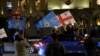 Susținători ai partidului Visul Georgian sărbătoresc după anunțarea rezultatelor exit-poll-urilor la Tbilisi