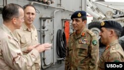 U.S. Joint Chiefs of Staff commander Admiral Mike Mullen (left) during a meeting at sea in August with Inter-Services Intelligence (ISI) agency commander Lieutenant General Ahmad Shuja Pasha (second from right)