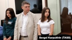 Maria (left) and Angelina (right) Khachaturyan attend a court hearing in Moscow on June 26.
