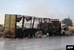 A gutted aid truck is seen on the side of the road in the town of Orum al-Kubra on the western outskirts of Aleppo on September 20. At least 20 civilians were killed in the atttack. The United States explicitly blamed Russia for the air strike.