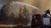 Pompierii încercă să stingă un incendiu din zona rurală Marmaris, districtul Mugla, Turcia. Fotografie realizată la data de 1 august 2021.