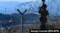 A Macedonian soldier patrols the border with Greece, near Gevgelija.