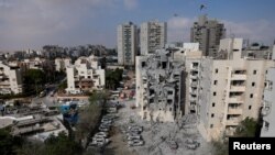 ისრაელის ქალაქ ბეერ-შევაში ირანული რაკეტით შეტევის შედეგად დანგრეული სახლი. 2025 წლის 24 ივნისი