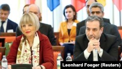 Iranian top nuclear negotiator Abbas Araqchi (right) and Helga Schmit, secretary-general of the European External Action Service, attend talks in Vienna on June 28.