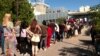 Citizens are waiting in line for a new identity card in front of the building of the Ministry of Internal Affairs, Podgorica, Montenegro
